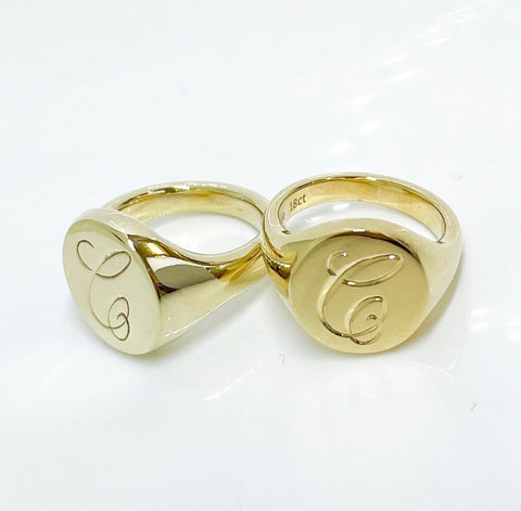 Gold signet ring with hand engraving.