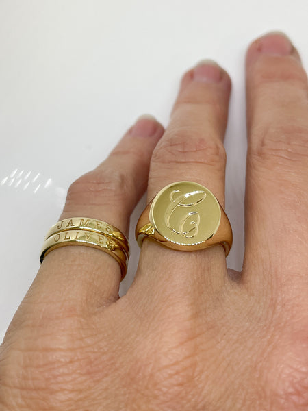 Gold signet ring with hand engraving.