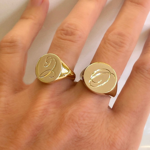 Gold signet ring with hand engraving.